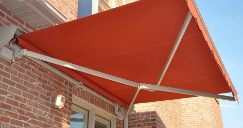 Cross arm retractable awning