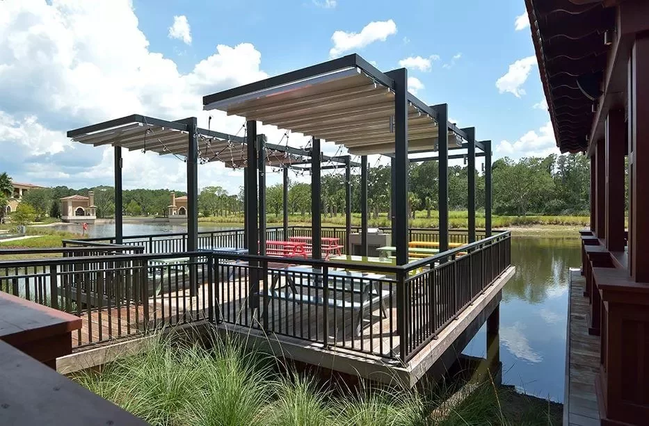 Portable outdoor awnings near a pond